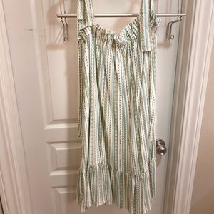 Smocked baby doll dress with tie straps